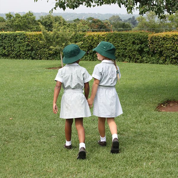 Admissions criteria square block FP girls holding hands